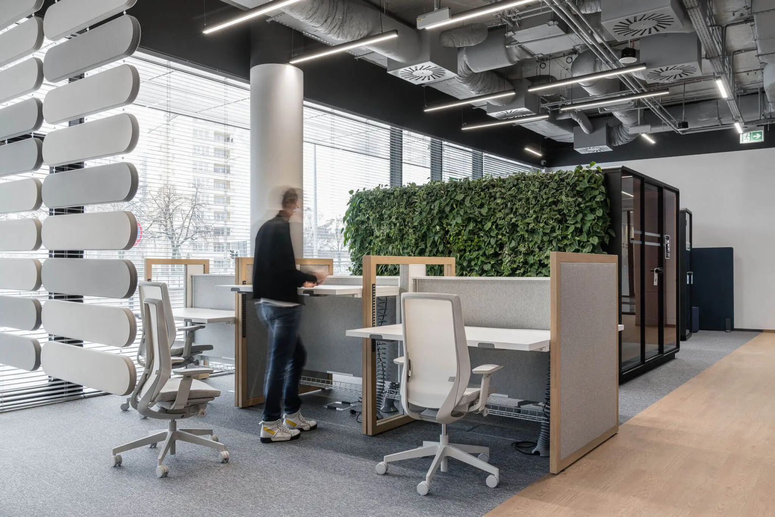 Acoustic pod beside the window wall