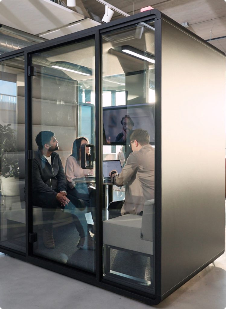 Person entering a Hushfree XM pod in a shared office