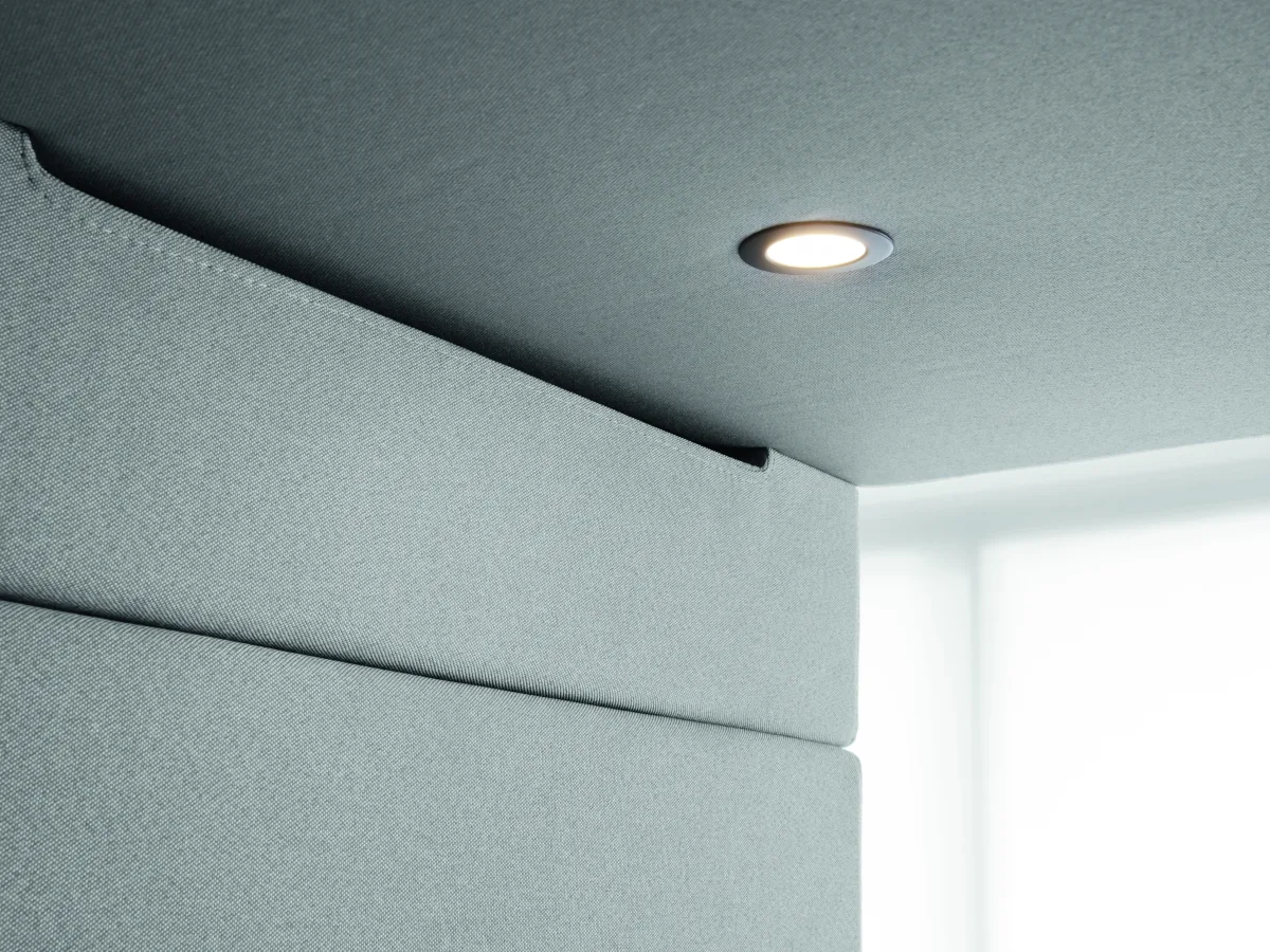 Ceiling of a Hushclassic pod with upholstered panels and light